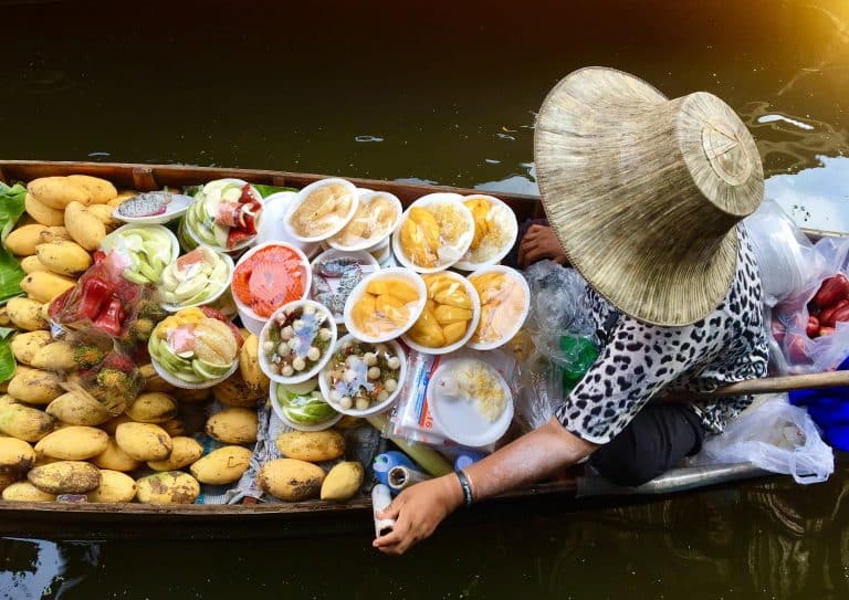 high angle view woman selling food boat lake